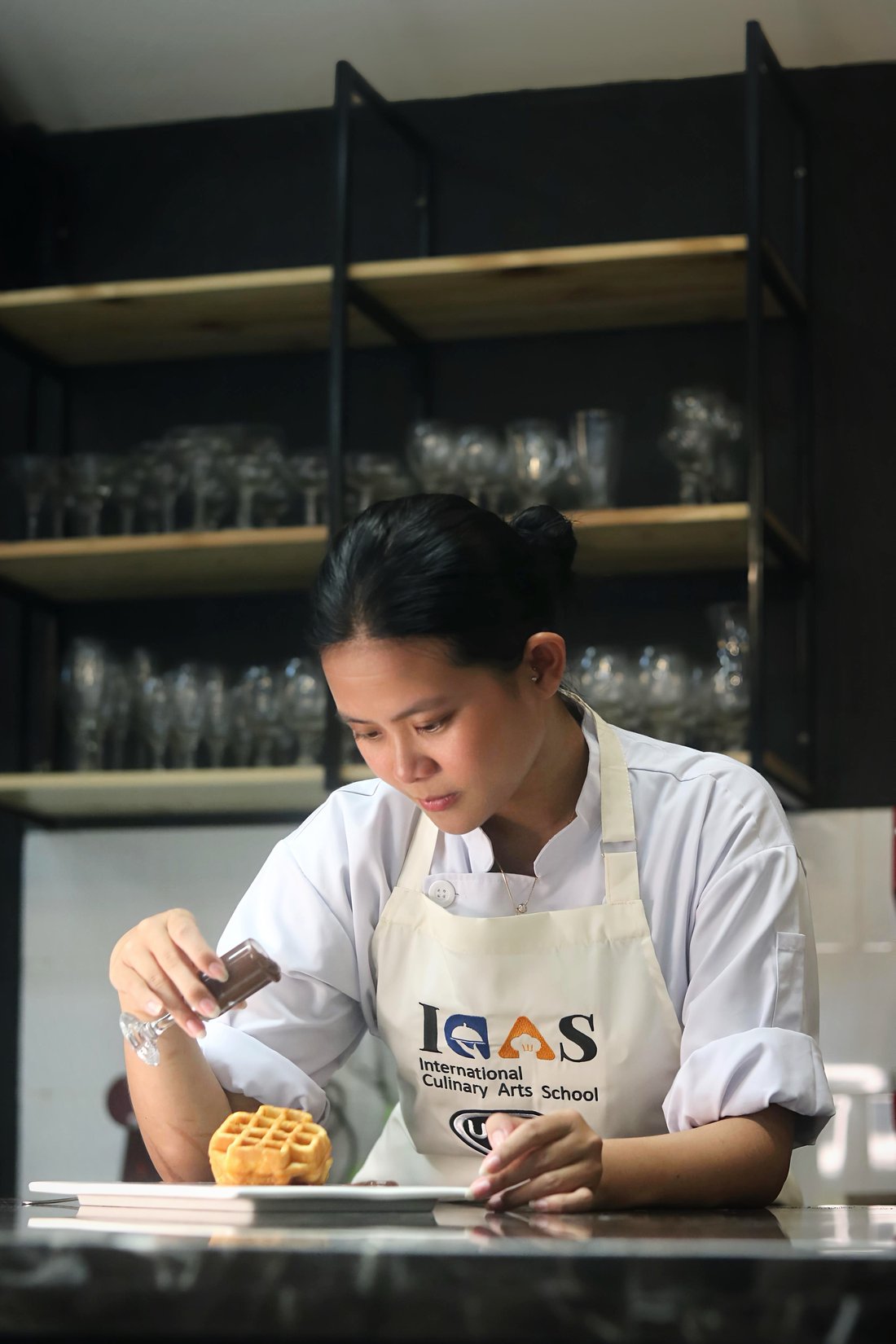 ICAS chef performing a flambé